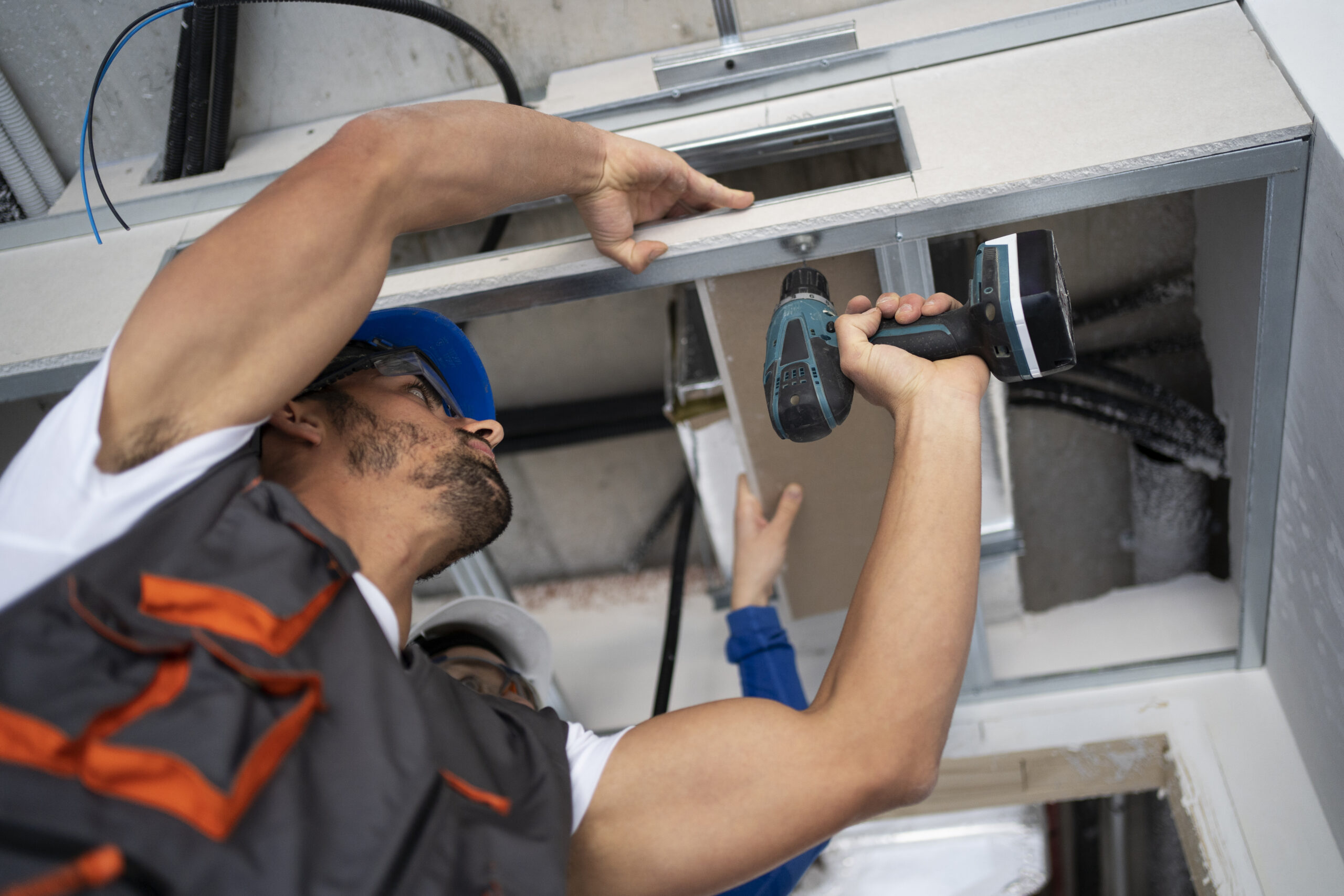 low-angle-people-working-with-drill low-angle-people-working-with-drill
